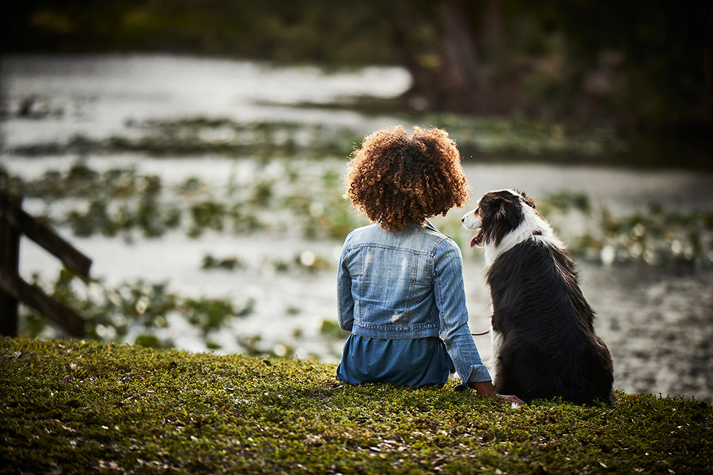 woman and dog sitting together